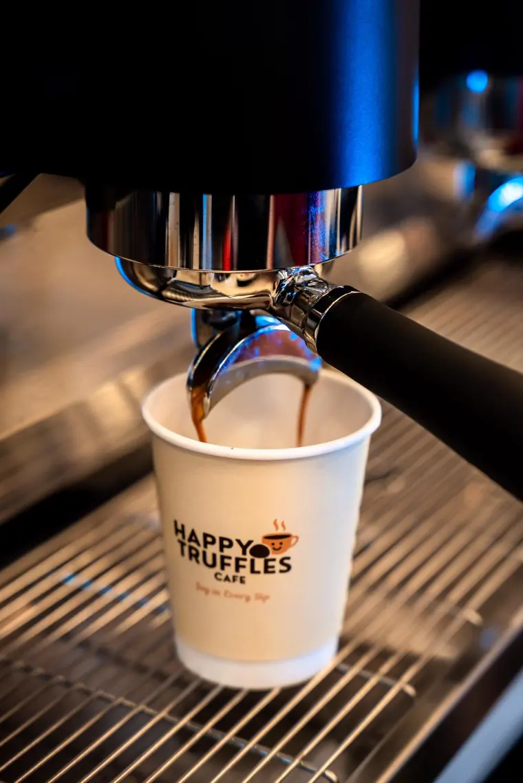 Espresso pouring into a Happy Truffles cup